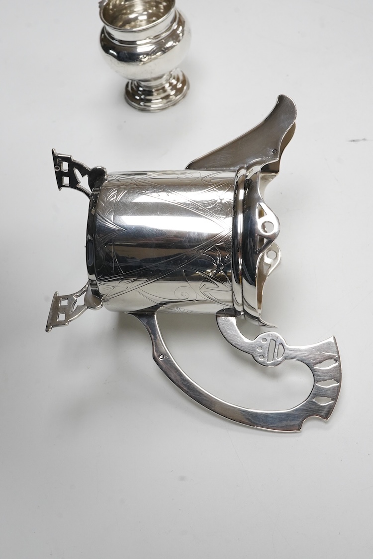 A late 19th/early 20th century Russian 84 zolotnik cream jug, with engraved decoration and angular feet and handle, master Andrei Ivanov, 1908-1917 kokoshnik mark, height 11.6cm, together with a similar single handled sm